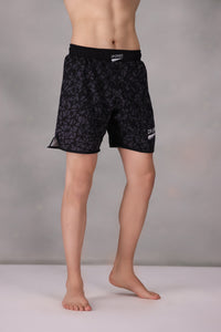 mens mma shorts uk Black patterned worn by a person