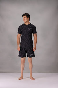 mens mma shorts uk Black patterned worn by a person