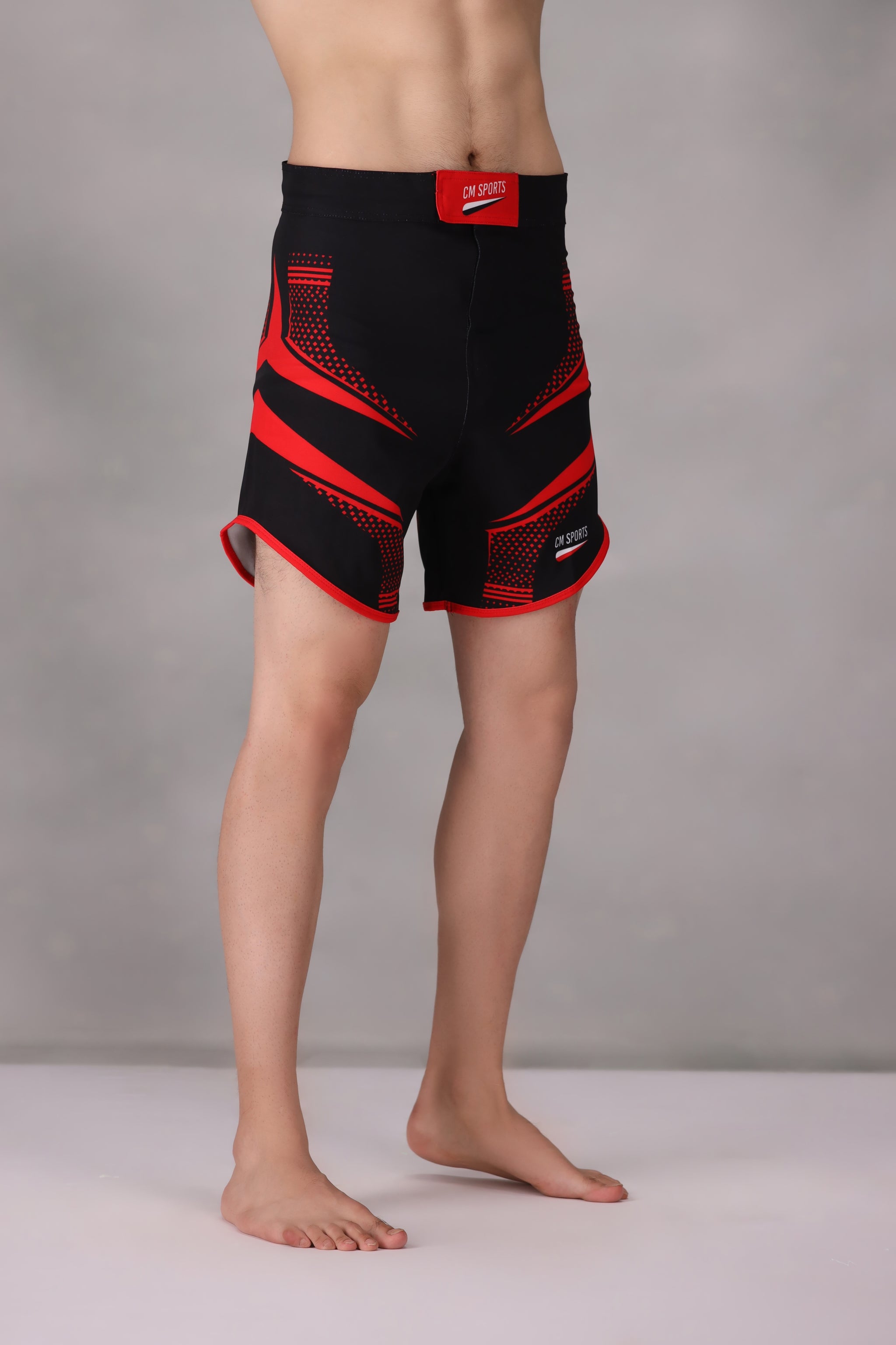 personalised mma shorts uk Black and red athletic shorts on a plain background