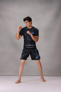 mma rashguards men wearing a black athletic outfit with Custom Made Sports branding on a gray background