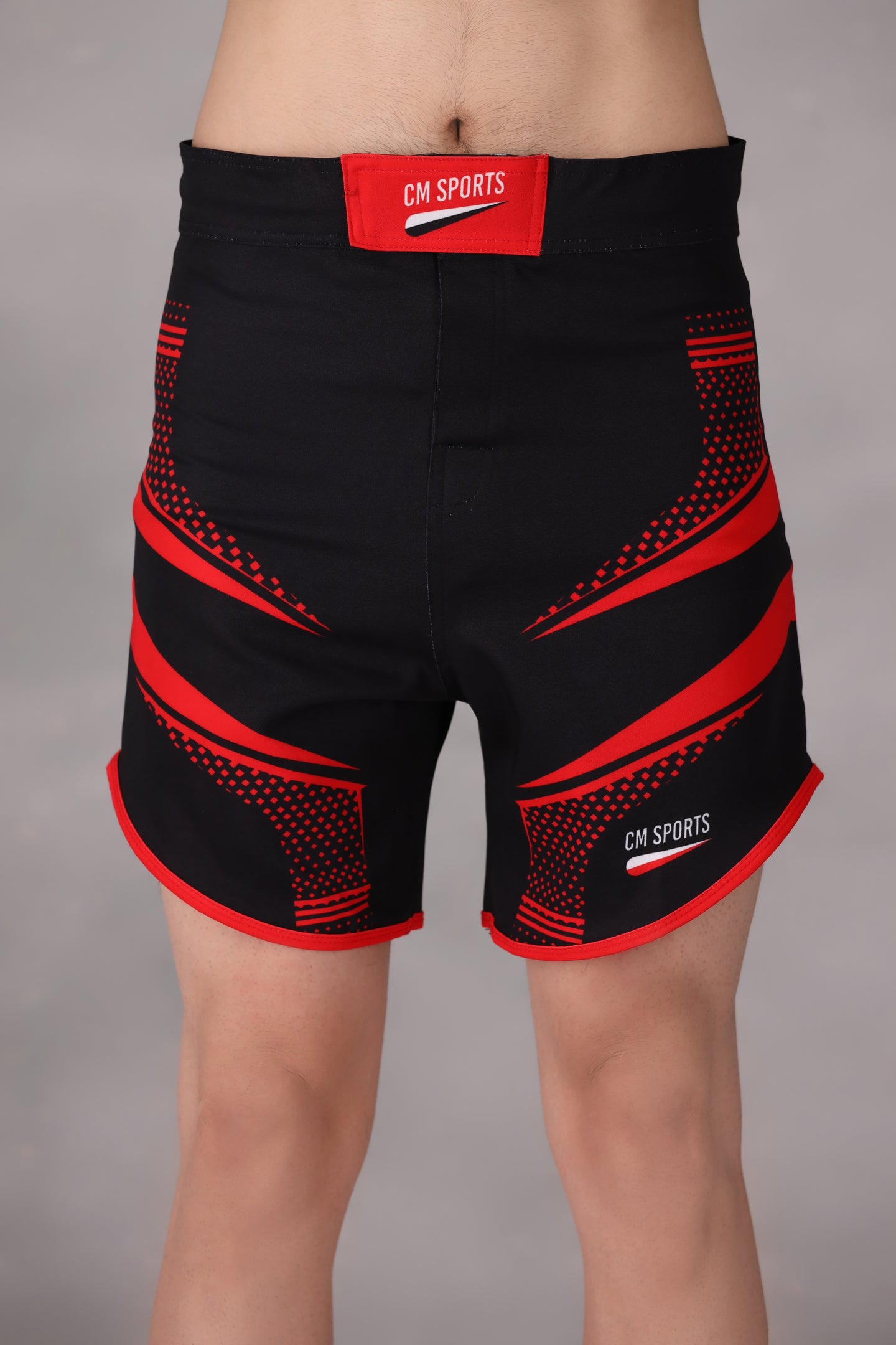 personalised mma shorts uk Black and red athletic shorts on a plain background